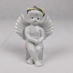 Boy Angel Sitting With Flowers On Head